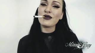 Mira Grey smoking in shiny latex