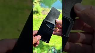 Waxy Black leather with white thread. This is my Silver Coin Mini wallet model.