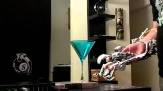 Prototype Mk I Mindstorms robotic hand picking up a martini glass