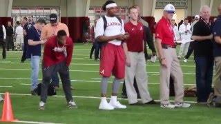 Derrick Henry times his teammates at Alabama's Pro Day