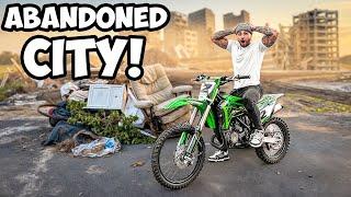 Taking 2 Stroke Dirt Bike Through Abandoned City ! | Braap Vlogs