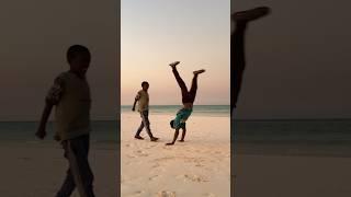 OUR YOUNG FAN DOING A HANDSTAND #yoga #handstand #beach #sunset #yogaflow #yogateacher