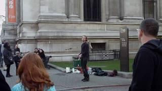 Fire Juggler outside the Museum of Natural History, London, England