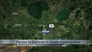 Burnett Co. investigating death, one in custody