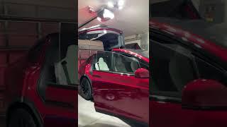 Model X Plaid Falcon Wing Doors in a garage