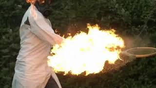 Man hits fiery tennis ball in slow motion