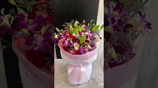 purple orchid,  lily bouquet @ creative florist