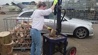 Wifey chopping logs and filling the cage for next season