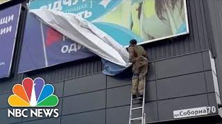 Ukrainian Troops Tear Down Russian Billboards After Zelenskyy Claims Military Successes