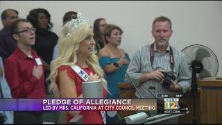 Alissa Carlson leads Pledge of Allegiance before city council meeting