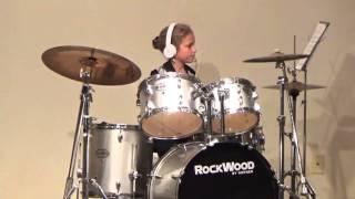 Sydney plays drums