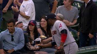 Uribe pretends to go for a fan's hot dog