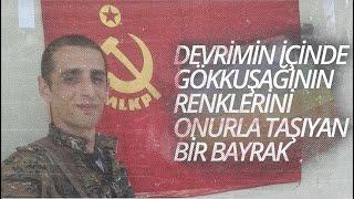 DEVRİMİN İÇİNDE GÖKKUŞAĞININ RENKLERİNİ ONURLA TAŞIYAN BİR BAYRAK - İSYAN TOLHİLDANE PİRSUSÊ