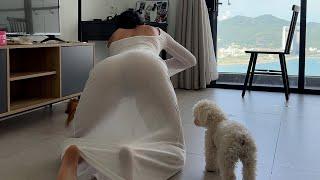 Cleaning the house in a transparent white dress with my favorite dog