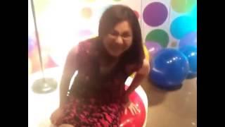 Cute Pinay Girl Sit Popping a Big Balloon