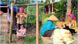 After harvesting corn to sell, mother made a swing for her daughter and they played together.