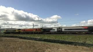 Freightliner intermodal and Avanti West Coast passenger trains meet at Scout Green, UK