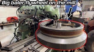 Repairing damaged shear bolt hole on big baler flywheel.