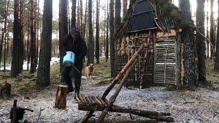 Building a warm log house. I install a stove, make a table and a chair from logs