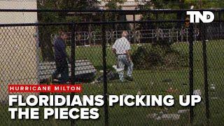 Neighbors work to pick up the pieces in Port Salerno after Hurricane Milton sweeps through