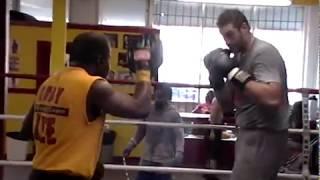 Hall of Fame Trainer Emanuel Steward working with a young Tyson Fury.