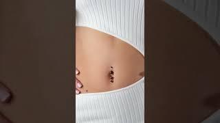 The power of a single accessory: This red garnet belly ring is art in motion.