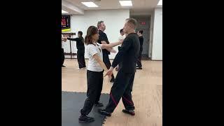 Teaching students on basic Wing Tsun techniques.