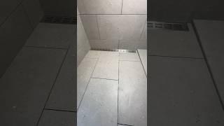 Laying tiles in a shower drain.      #tiler #tilerwork #bathroom #construction #interiordesign