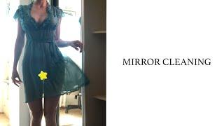 Transparent mirror cleaning with Tina in a dress