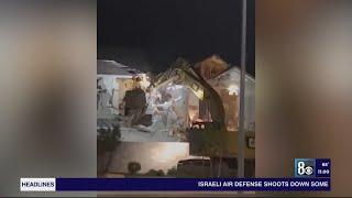 Crews apparently dismantling home as barricade in a Henderson community reaches 33rd hour