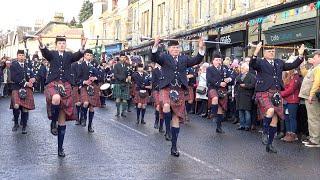 The Vale of Atholl Pipe Band with 3 Drum Majors start their New Year's display in Pitlochry Jan 2020