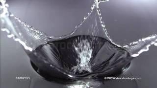 Clear glass cube falling into water, Slow Motion