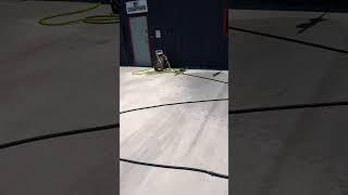 watering the driveway... apparently you're supposed to #concrete #driveway #automobile #dealership