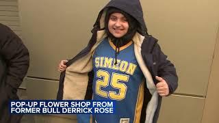 Former Bulls star Derrick Rose gives out flowers, takes photos with fans at pop-up shop