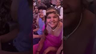 Me and my family at a concert taking a video