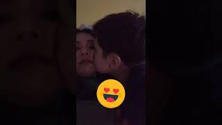 Son kiss mom on the lip