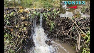 HOLE IN THE BEAVER DAM WHICH HAS MADE VORTEX DURING REMOVAL