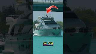 Yacht crew rushes to lower antenna to clear the Haulover Bridge | Wavy Boats