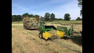 JOHN DEERE square Baler 339 baling hay in Sweden with New Holland TL90A tractor