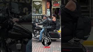 Man And Wife With Harley Davidson Street Glide on the Street