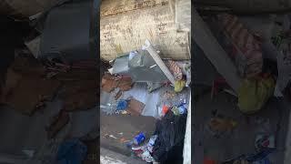 Garbage truck eats stove appliance smash crushed