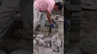 Grey brick partition wall installation