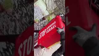 Greenpeace activists pour blood red dye in waters around US embassy in London over Gaza
