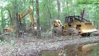 Trackhoe Pulling Out The Skidder! Caterpillar 518 320 Stuck Logging Wet Mud