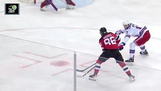 Jack Hughes scores a goal against the New York Rangers