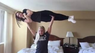 Strong blonde overhead lift carry brunette