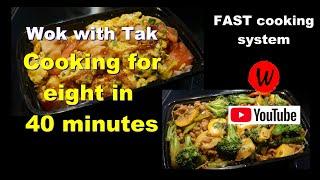 Wok with Tak.  Cooking for eight in 40 minutes.