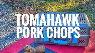 Outdoor cooking Tomahawk Pork Chops on the Nomad Grill - suitcase bbq - wilderness food camping
