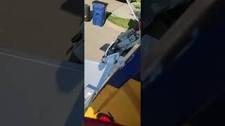 crushing a washer and dryer with trash truck