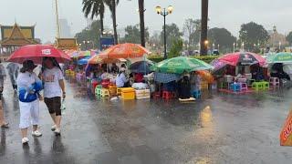 Selling Food in a Heavy Rain at Chaktomuk Walk Street , Phnom Penh City, Cambodia